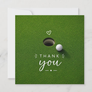 Golfbal naast hole op groen gras Bedankt 
