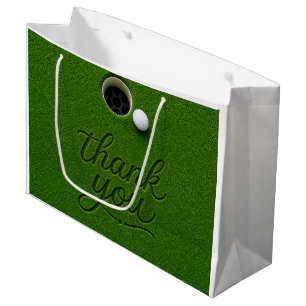 Golfbal naast hole op groen gras Bedankt  Groot Cadeauzakje