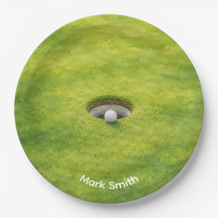 Golfbal naast hole op groene gras golfbaan papieren bordje