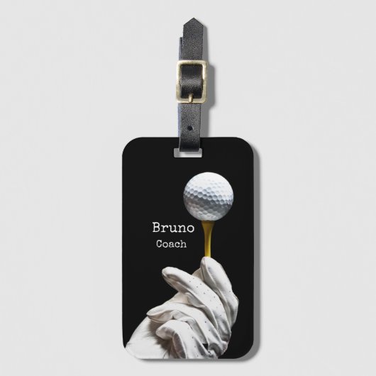 Golfbal op een speld naast een zwarte opening bagagelabel (Voorkant (verticaal))