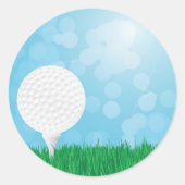 golfbal op gras ronde sticker (Voorkant)