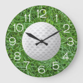 Golfbal op groen gras grote klok (Voorkant)