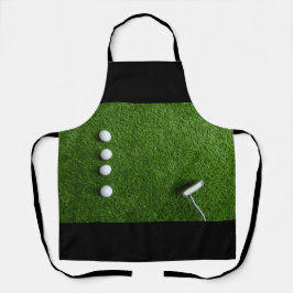 Golfbal op groen gras schort