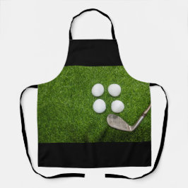 Golfbal op groen gras schort