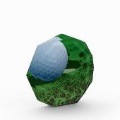 Golfbal op het groen fotoblokken (Links)