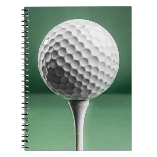 Golfbal op T-shirt Notitieboek (Voorkant)