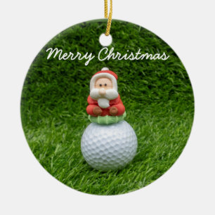 Golfbal Santa Claus is op groen gras kerstmis Keramisch Ornament