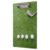 Golfballen op een groene graslaptop klembord (Links)