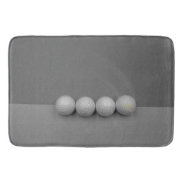 Golfballen op grijze achtergrond badmat
