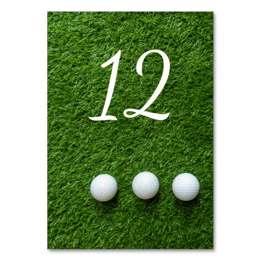 Golfballen op groen gras kaart (Voorkant)