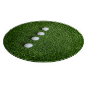Golfballen zijn op groen gras snijplank (Hoek)