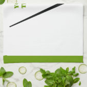 Golfclub en zwarte bal, groene gewoonte theedoek (Gevouwen)