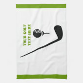 Golfclub en zwarte bal, groene gewoonte theedoek (Verticaal)