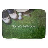 Golfertoilet met golfballen op groen gras b badmat (Voorkant)