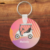 Golfkarretje op roze kleurrijke achtergrond met na sleutelhanger (Voorkant)