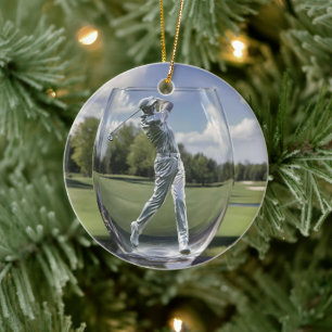 Golfspeler in een glazen tuimelaar met golfbaan, keramisch ornament