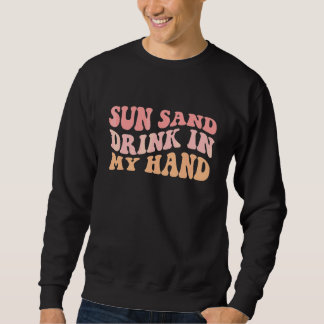 Golvende zon zand drank in mijn hand ring aan mijn trui