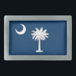 Gordelgesp met vlag van de staat South Carolina Gesp<br><div class="desc">Voeg een vleugje zuidelijke charme toe aan je garderobe met deze stijlvolle riemgesp met de vlag van South Carolina! Vervaardigd met duurzame materialen en versierd met de iconische palmettoboom en het maanontwerp van de halve maan van South Carolina's flag, is deze gordelgesp zowel een mode statement als een symbool van...</div>