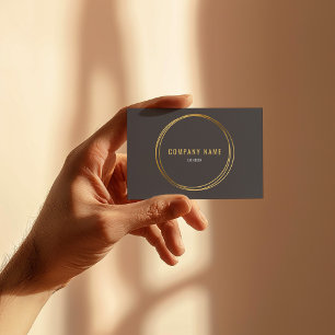 Goud effect, gouden ringen, grijze achtergrond vet visitekaartje