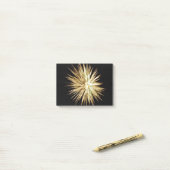 Goud en groen vuurwerk barst uit post-it® notes (Op bureau)