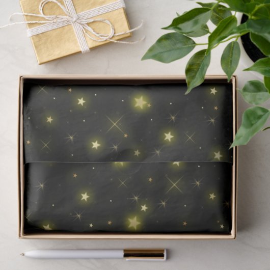 Goud en sparkles sterren op zwart tissuepapier (Geschenk)