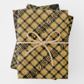 Goud en zwart geplakt met kersttekst inpakpapier vel (In situ)