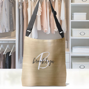 Goud geborsteld metaal zwart wit schrift monogram crossbody tas