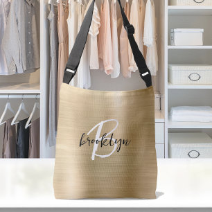 Goud geborsteld metaal zwart wit schrift monogram crossbody tas