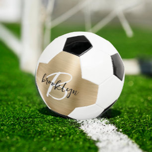 Goud geborsteld metaal zwart wit schrift monogram voetbal