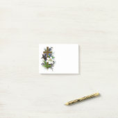 Goud kruis met witte ventilator post-it® notes (Op bureau)