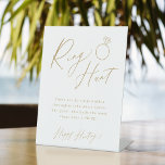 Goud minimaal de jachtspel van de manuscriptring v reclamebord met voetstuk<br><div class="desc">Vermaak uw gasten met dit leuke ringjacht vrijgezellenfeest ringgame,  eigenschappen stijlvol modern script en tekst in gouden kleur,  eenvoudig en schoon,  geweldig voor vrijgezellenfeest en bruiloft feestjes. Bekijk alle vrijgezellenfeest games in collectie.</div>