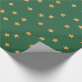 Goud sterren op groen cadeaupapier (Hoek)