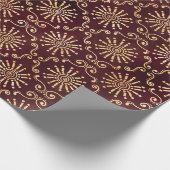 Goudcirkels en wervelingen op donkerrood cadeaupapier (Hoek)