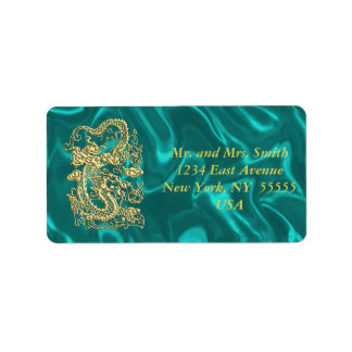 Gouddraak in reliëf op Turquoise Satin Print Etiket