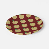 Gouden appel op rood papieren bordje (Gekanteld)