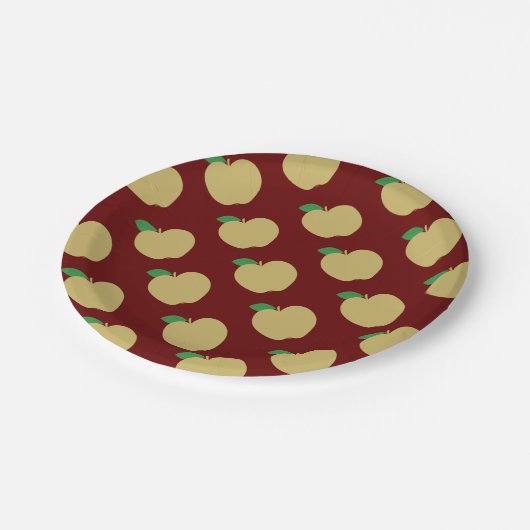 Gouden appel op rood papieren bordje (Gekanteld)
