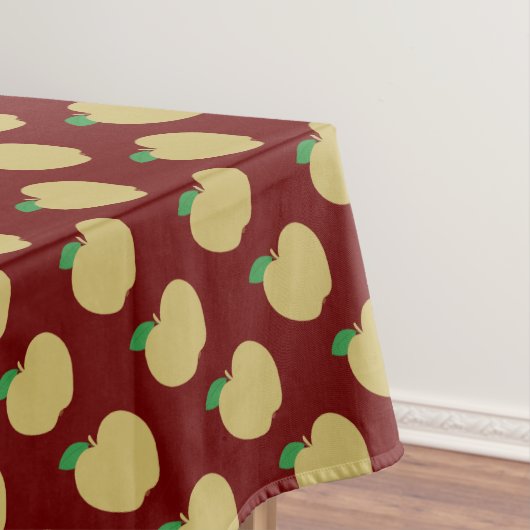 Gouden appel op rood tafelkleed (Voorbeeld)