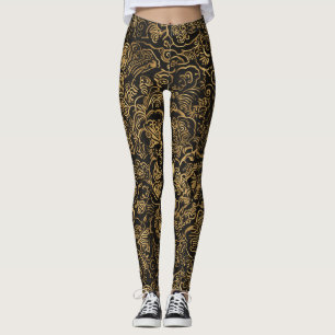 Gouden bloempatroon in barokstijl op zwart leggings