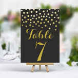 Gouden Confetti Elegant Zwart Tafelnummer Kaart<br><div class="desc">Voeg een vleugje glamour en glans toe aan uw huwelijksreceptie met deze elegante tafelnummers. Deze kaarten hebben een gedurfde zwarte achtergrond met een cascade van glinsterende gouden confetti en creëer een moderne en chique uitstraling. Personaliseer eenvoudig met uw tafelnummers voor een samenhangende en onvergetelijke tafelsetting.</div>
