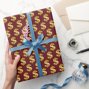 Gouden dollarteken op bordeauxrood cadeaupapier