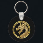 Gouden draak sleutelhanger<br><div class="desc">Draag een stuk elegantie en kracht met de Golden Dragon-Sleutelhanger. Deze sleutelhanger heeft een prachtig gouden drakenontwerp en is de perfecte mix van luxe en symboliek, waardoor het een verfijnd accessoire is voor hem of haar. Compact maar toch gedurfd, het is een subtiele manier om kracht en stijl te laten...</div>