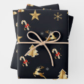 Gouden en rode kerstsymbolen inpakpapier vel (In situ)