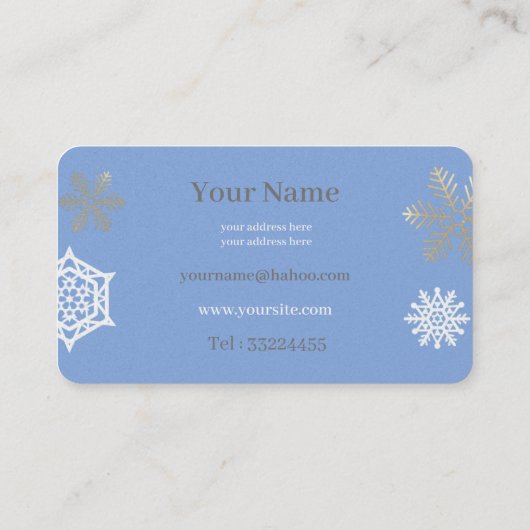 gouden en witte sneeuwvlokken in lichtblauw visitekaartje (Achterkant)
