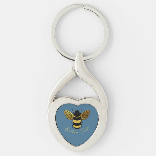 GOUDEN EN ZWARTE HOMMEL OP BLAUW MET SCRIPTTEKST SLEUTELHANGER (Voorkant)