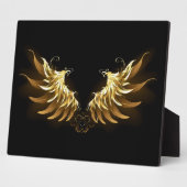 Gouden engelenvleugels op een zwarte achtergrond fotoplaat (Zijkant)