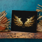 Gouden engelenvleugels op een zwarte achtergrond fotoplaat (Zijkant)