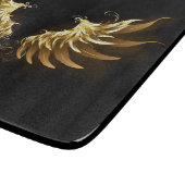 Gouden engelenvleugels op een zwarte achtergrond snijplank (Hoek)