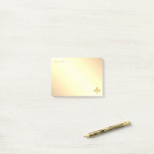 Gouden Fleur de Lis op Gouden Gradiënt Post-it® Notes (Op bureau)
