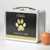 Gouden glanzende hondenpoot op zwarte achtergrond (In situ)