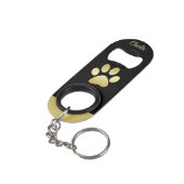 Gouden glanzende hondenpoot op zwarte achtergrond mini flessenopener (Achterkant Gekanteld)